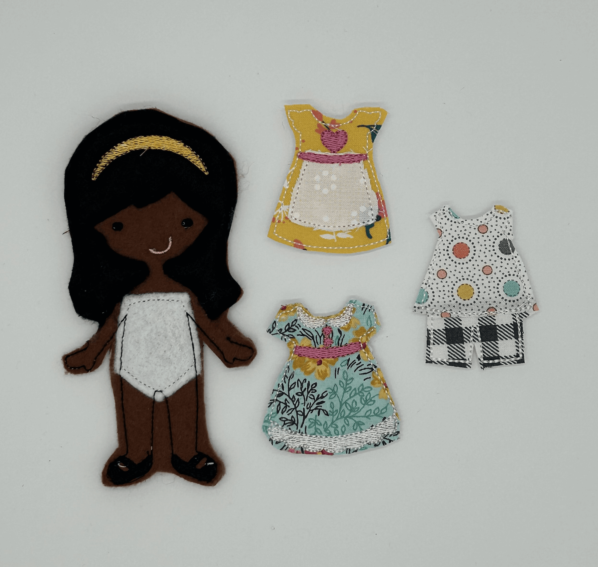 Felt and cloth "paper style" doll with wardrobe