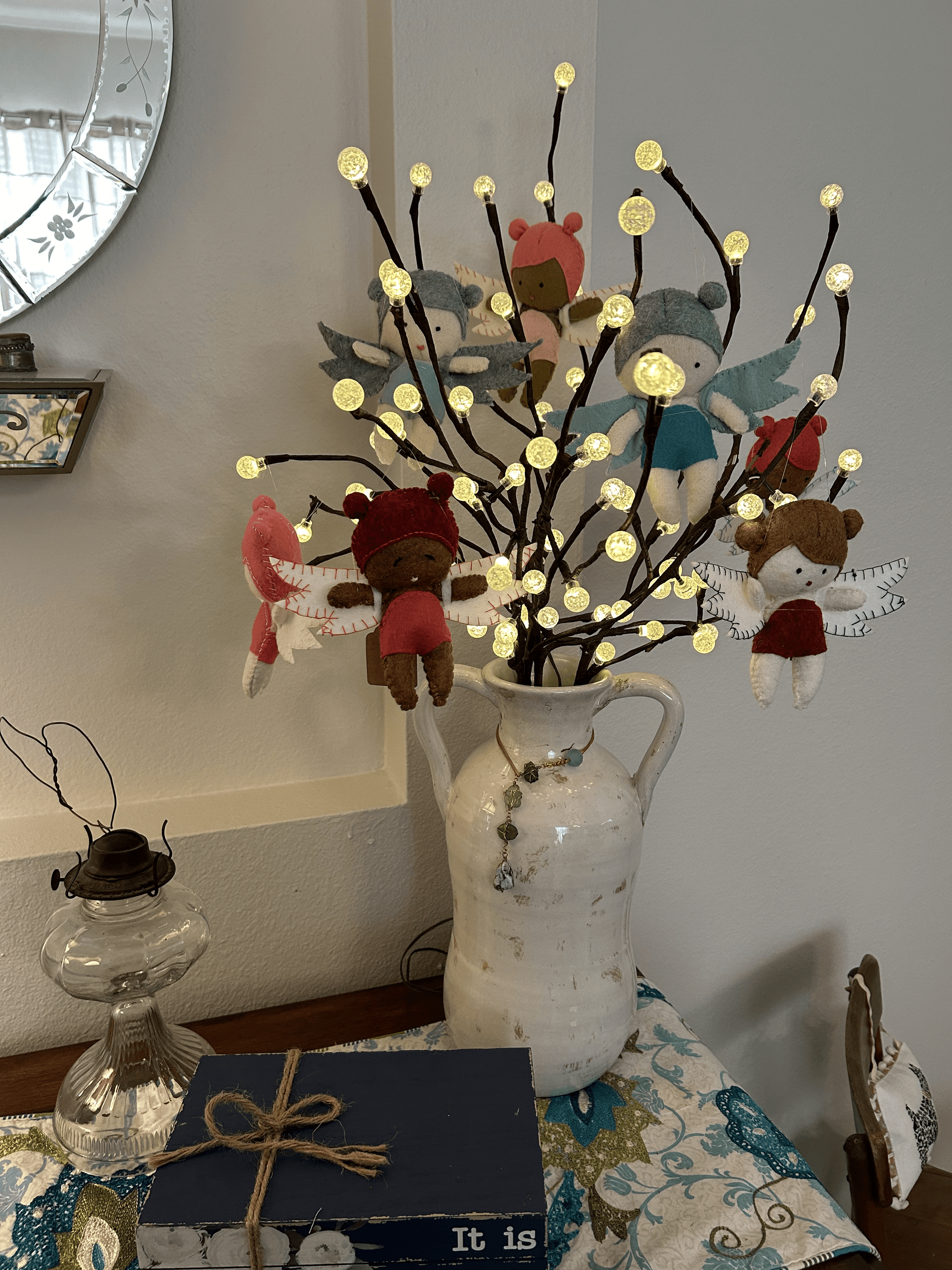 Group of felt Tooth Fairies on lighted branches in vase